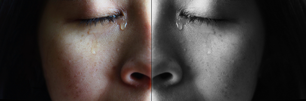 Close Up Face Of Asian Woman Crying With Tears, Isolated On Dark